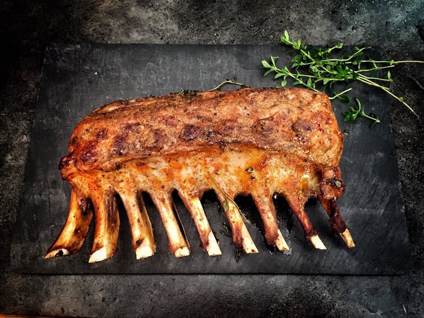 A rack of slow-roasted ribs on a slate board